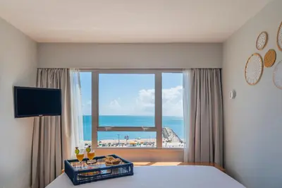 Uma televisão e/ou sistema de entretenimento em Praiano Hotel