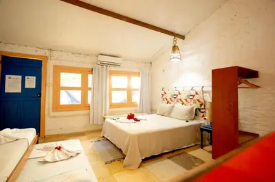 Uma cama ou camas num quarto em Barriga Da Lua Flats