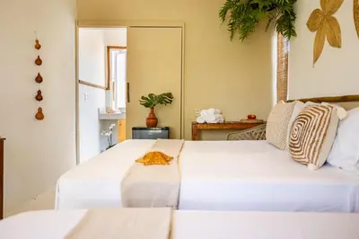 Uma cama ou camas num quarto em Preá Kite House