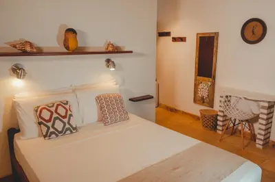 Uma cama ou camas num quarto em Pousada Carioca - Pousada de Charme