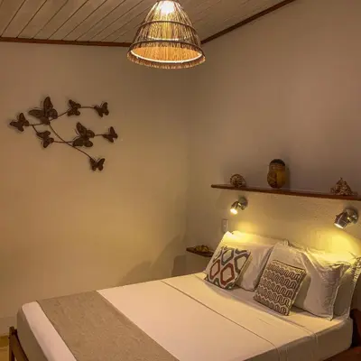 Uma cama ou camas num quarto em Pousada Carioca - Pousada de Charme