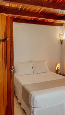 Uma cama ou camas num quarto em Pousada Carioca - Pousada de Charme