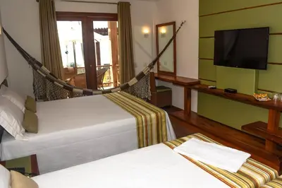 Uma cama ou camas num quarto em Genus Beach Hotel