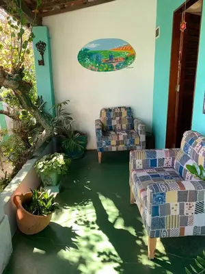 Uma área de estar em Pousada da Lucinha