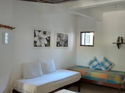 Uma cama ou camas num quarto em Vila Beija-flor