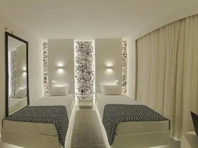 Uma cama ou camas num quarto em Golden Tower Maracanaú by Fênix Hotéis