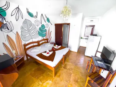 Uma televisão e/ou sistema de entretenimento em Cumbuco Kite in Paradise e Hospedaria