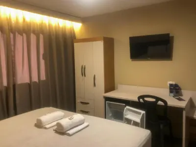 Uma cama ou camas num quarto em Pecém Hotel