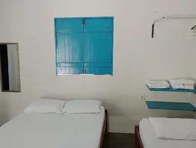 Uma cama ou camas num quarto em Pousada Infinito Azul