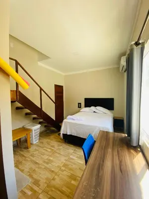Uma cama ou camas num quarto em Chalés Canto do Mar
