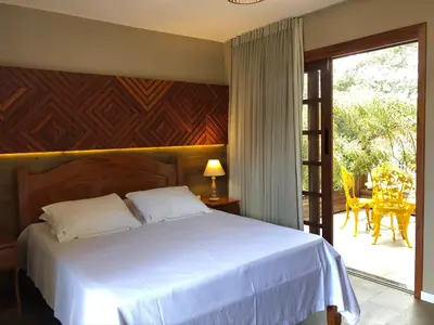 Uma cama ou camas num quarto em Le Rêve Pousada e Restaurante