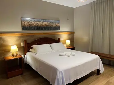 Uma cama ou camas num quarto em Le Rêve Pousada e Restaurante