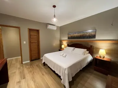 Uma cama ou camas num quarto em Le Rêve Pousada e Restaurante