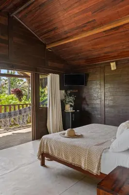 Uma cama ou camas num quarto em Pousada Pais Tropical