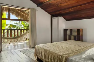 Uma cama ou camas num quarto em Pousada Pais Tropical