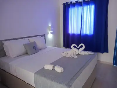 Uma cama ou camas num quarto em La Suite Praia Hotel
