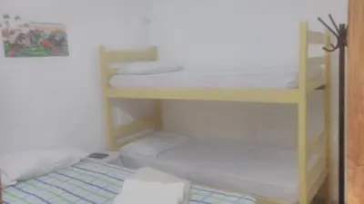 Uma cama ou camas num quarto em Hospedaria Praia e Sol