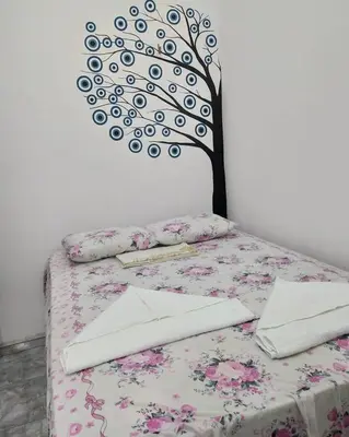 Uma cama ou camas num quarto em Suíte central Pousada