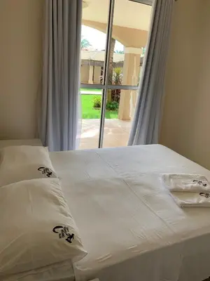 Uma cama ou camas num quarto em Residence Cumbuco Paradise Beach