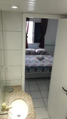 Uma cama ou camas num quarto em Apartamentos Vila de Iracema