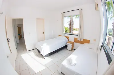 Uma cama ou camas num quarto em Blue Beach Temporada