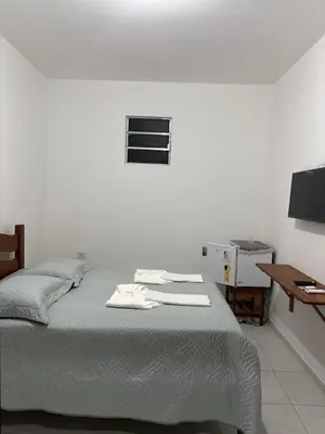 Uma cama ou camas num quarto em Pousada Águas Claras