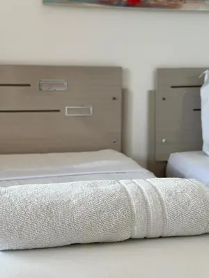 Uma cama ou camas num quarto em Pousada Amor a Mar Pé na Areia na Praia de Barreiras, Icapuí