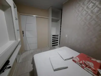 Uma cama ou camas num quarto em Apartamento Central