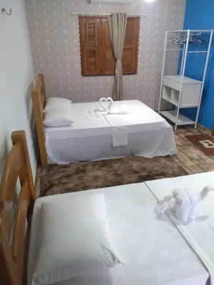 Uma cama ou camas num quarto em Pousada e Restaurante Lagoa Azul