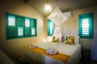 Uma cama ou camas num quarto em La Villa Tropicale linda casa pertinho do mar !