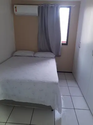 Uma cama ou camas num quarto em Porto de Iracema