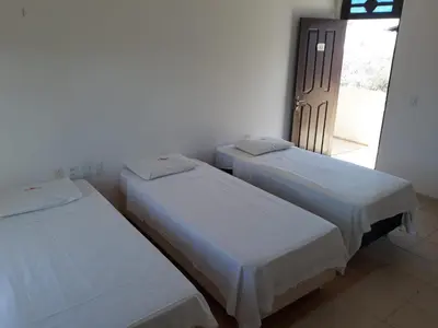 Uma cama ou camas num quarto em Hotel Pousada Summer Way