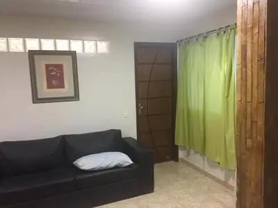 Uma área de estar em Maresia Flats
