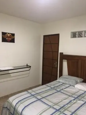 Uma cama ou camas num quarto em Maresia Flats