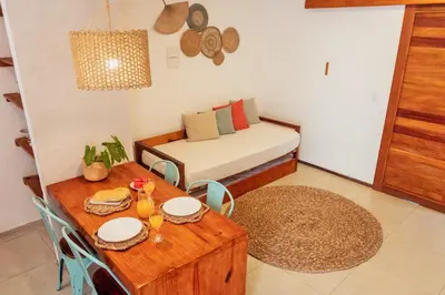 Uma área de estar em Apartamento Manay