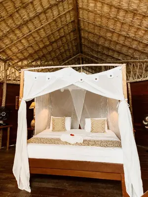 Uma cama ou camas num quarto em Villa Sabiá - Eco Bungalows