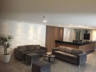 Uma área de estar em Atlântico Flat Residence