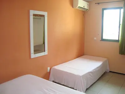 Uma cama ou camas num quarto em Pousada Vianna's