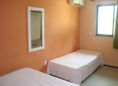 Uma cama ou camas num quarto em Pousada Vianna's