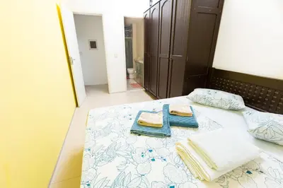 Uma cama ou camas num quarto em Cumbuco Kite Village Deluxe