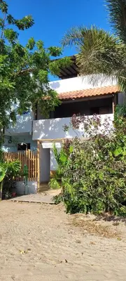 Um jardim no exterior de Villa Dunas Jeri