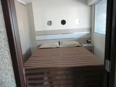 Uma cama ou camas num quarto em Apartamento Vista Mar 4 Suítes