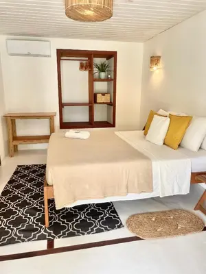 Uma cama ou camas num quarto em Villa Caribou