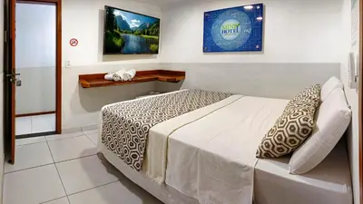Uma cama ou camas num quarto em Rede Andrade Mini