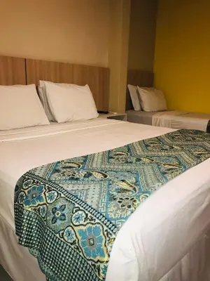 Uma cama ou camas num quarto em Hotel Pousada Latitude