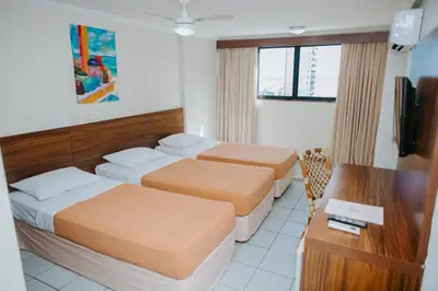 Uma cama ou camas num quarto em Rede Andrade Casa Blanca