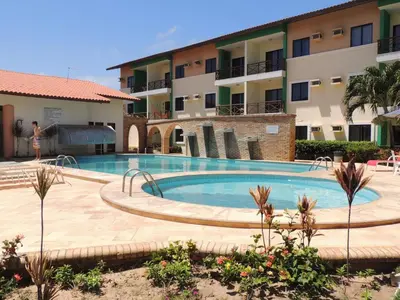 A piscina em ou perto de CONDOMÍNIO VILA DO MAR aptos 201C e 211B