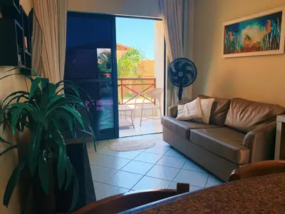 Uma área de estar em CONDOMÍNIO VILA DO MAR aptos 201C e 211B
