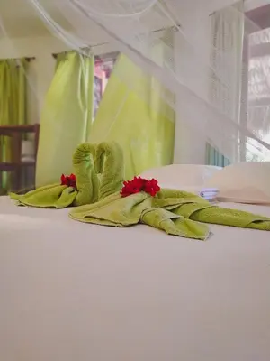 Uma cama ou camas num quarto em Refugios Parajuru - Villa Alegre