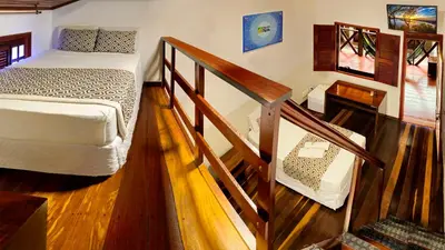 Uma cama ou camas num quarto em Rede Andrade Pousada do Norte